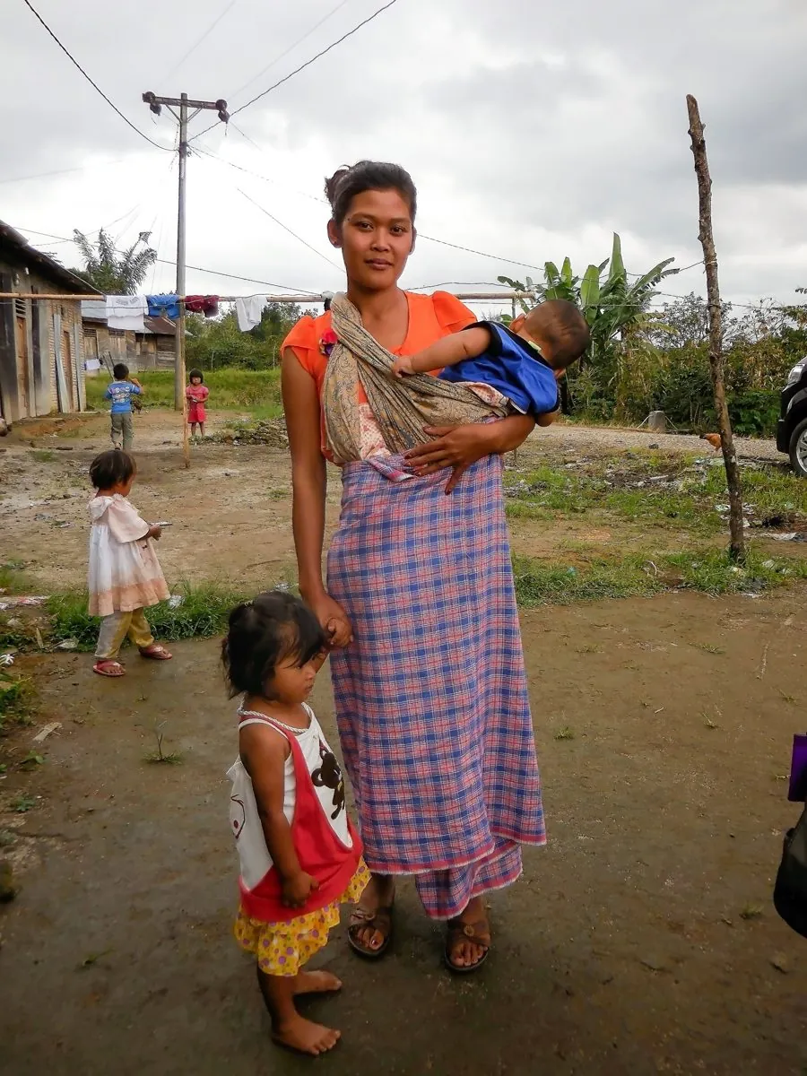 Fitri, a young mother in Indonesia, with her children