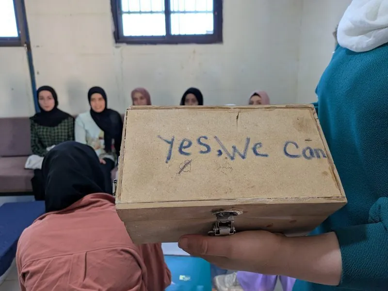 Women with supply box
