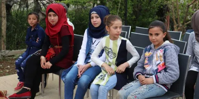 Photo of Middle Eastern girls sitting together